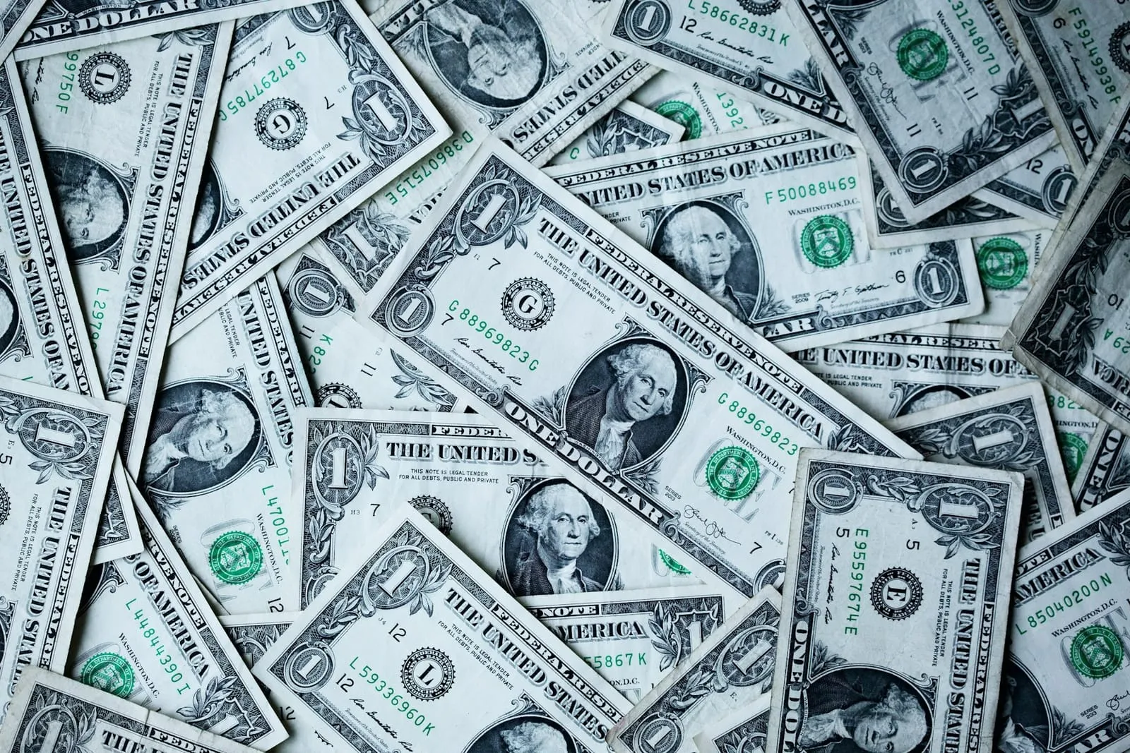 A pile of US one-dollar bills seen from above